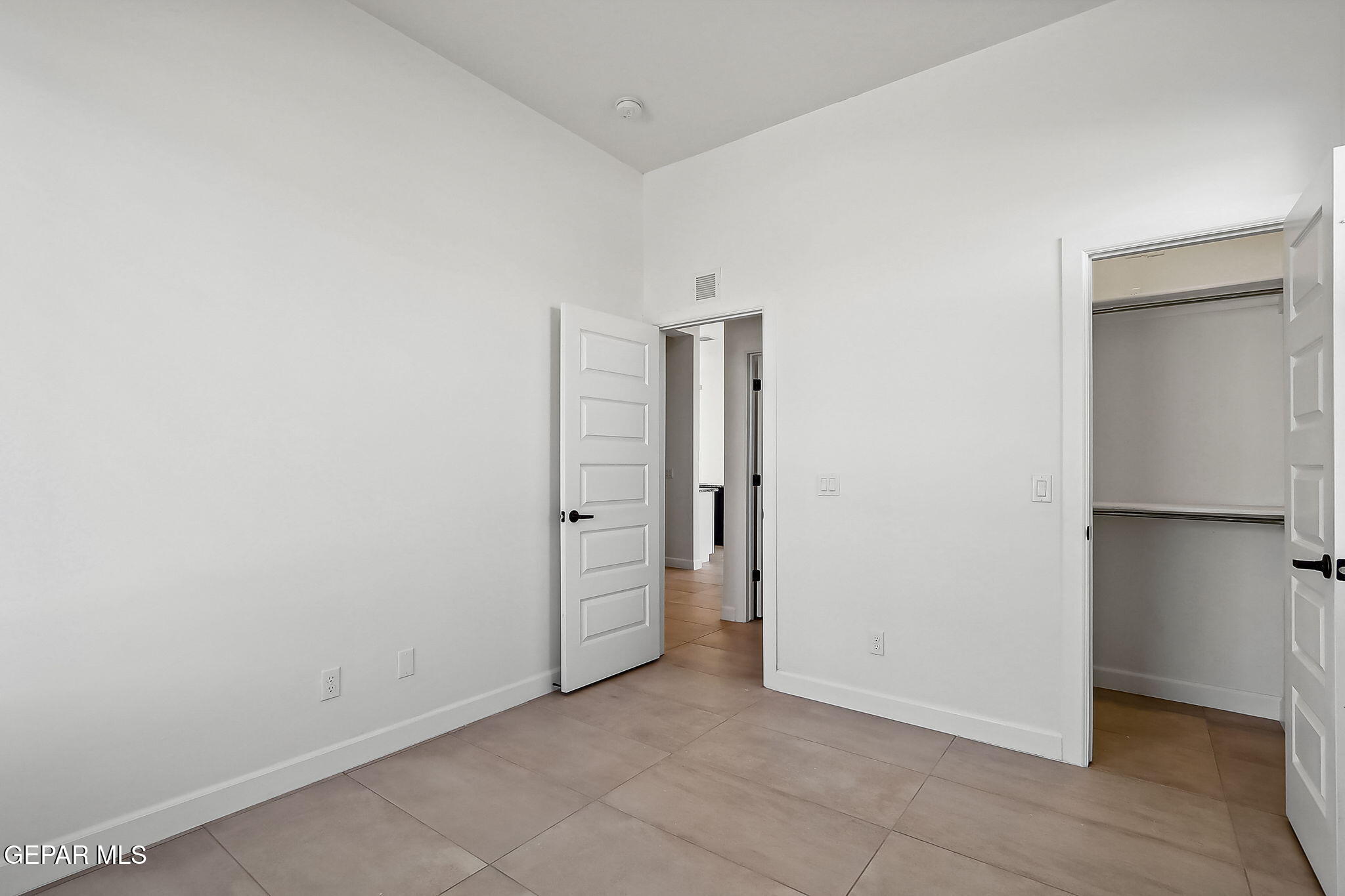 5997 Ruidoso Downs Street El Paso, TX 79932 - Photo 17 of 42 an empty room with closet