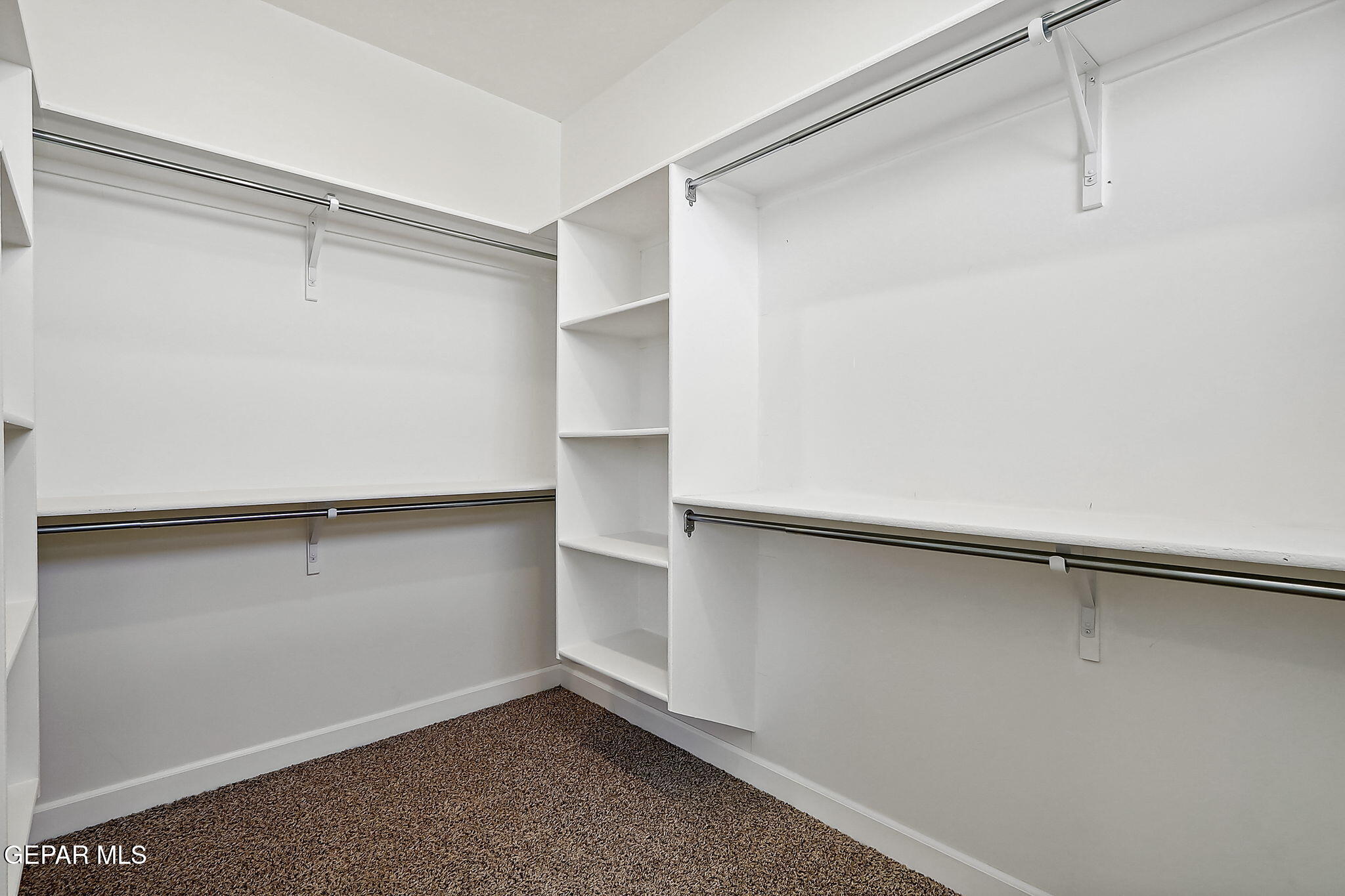 5997 Ruidoso Downs Street El Paso, TX 79932 - Photo 28 of 42 a view of an empty walk in closet
