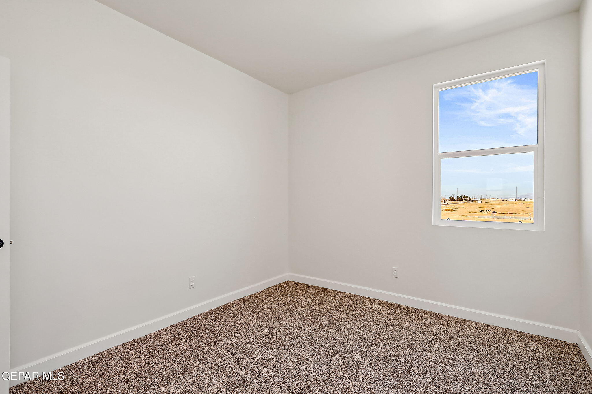 5997 Ruidoso Downs Street El Paso, TX 79932 - Photo 33 of 42 an empty room with a window