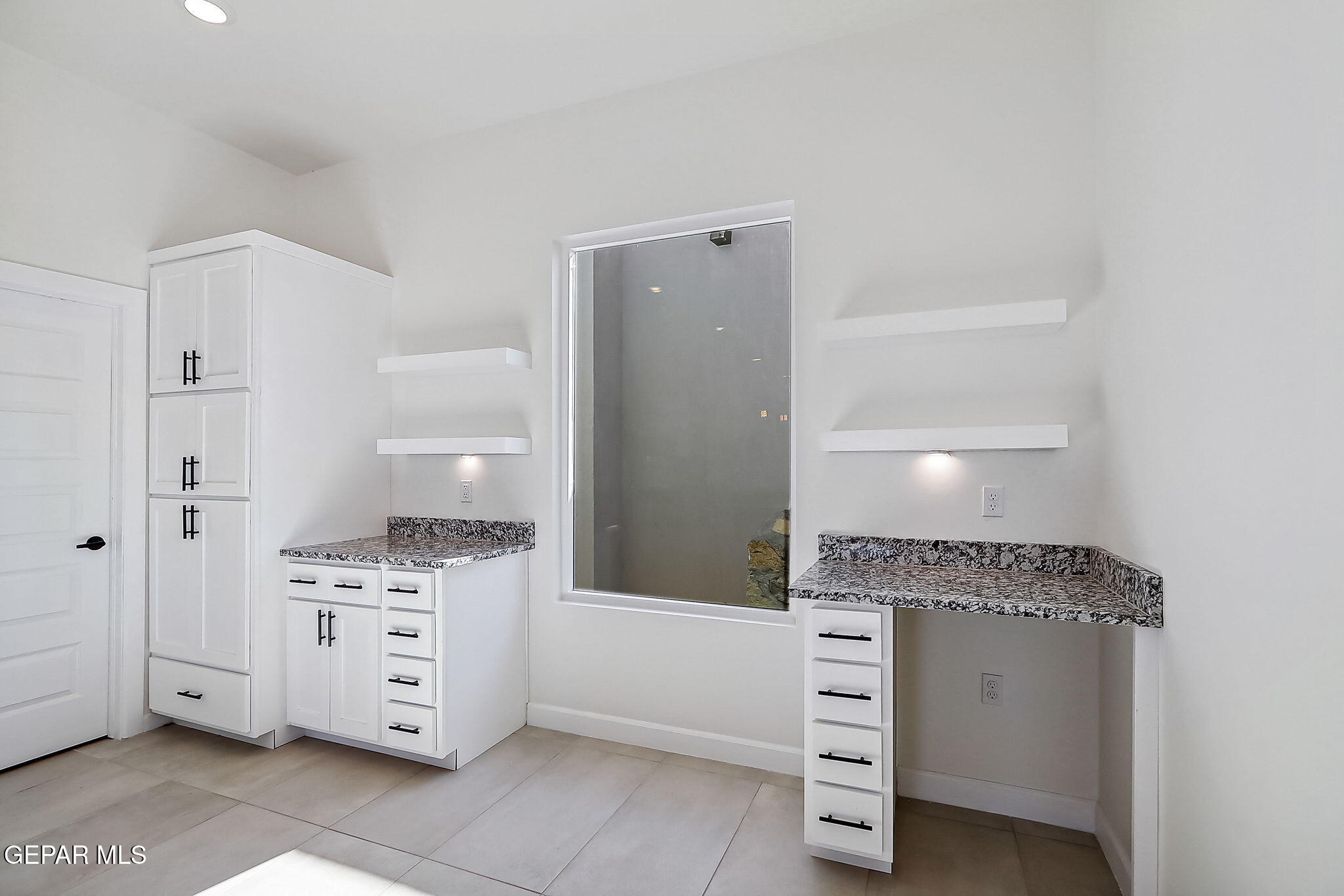 5997 Ruidoso Downs Street El Paso, TX 79932 - Photo 8 of 42 a kitchen with a stove and cabinets