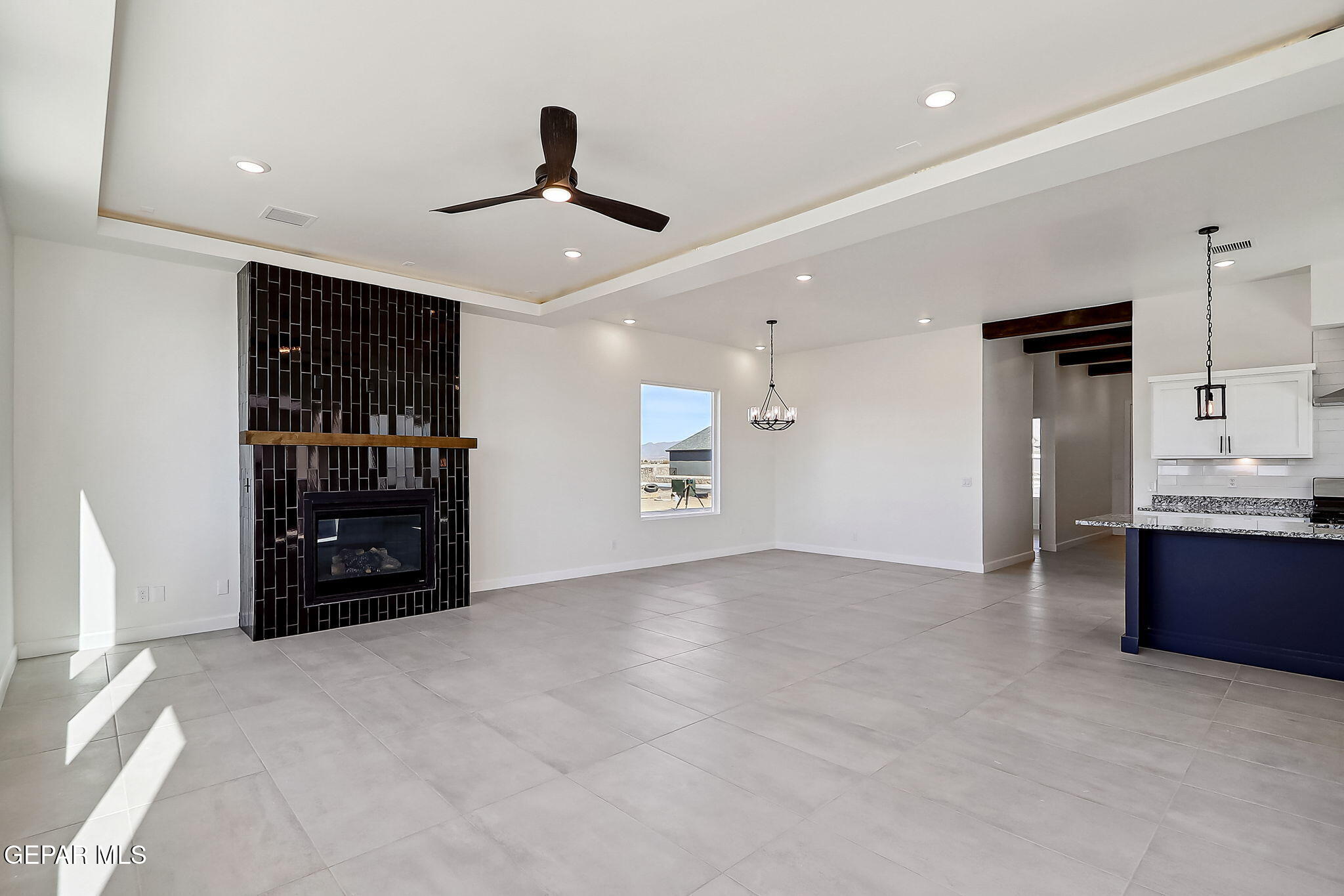 5997 Ruidoso Downs Street El Paso, TX 79932 - Photo 9 of 42 a view of an empty room with cabinet and a window