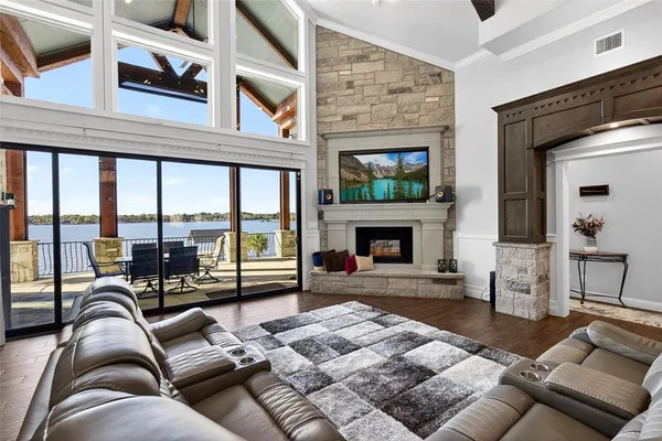 a living room with furniture fireplace and a flat screen tv