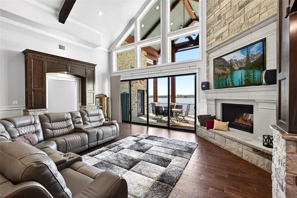 a kitchen with stainless steel appliances granite countertop a sink a stove and a refrigerator