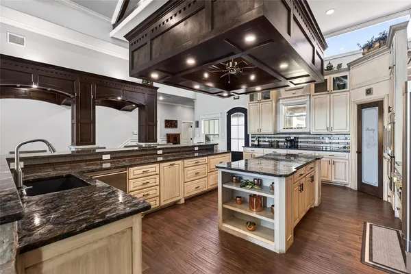 a large kitchen with stainless steel appliances granite countertop lots of counter top space