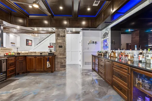 a kitchen with stainless steel appliances granite countertop a sink and stove