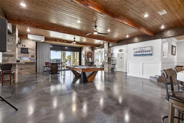 a livingroom with furniture and large glass door