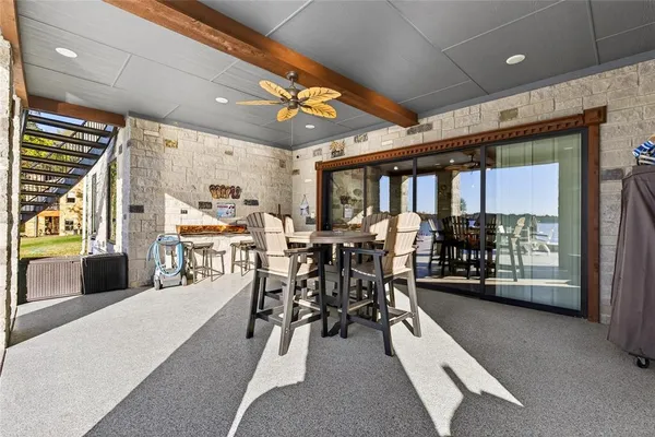 a very nice looking kitchen with wooden floor and furniture