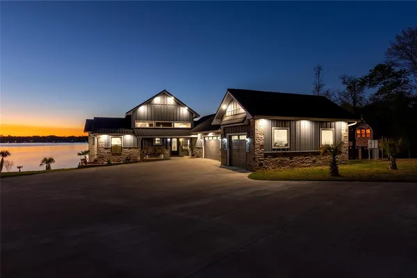 a view of swimming pool with red chairs