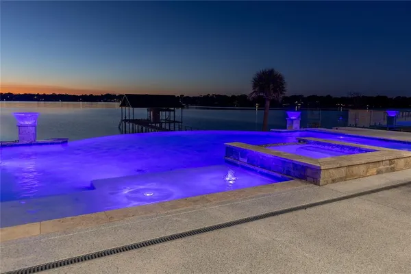 a front view of a house with a garden and patio