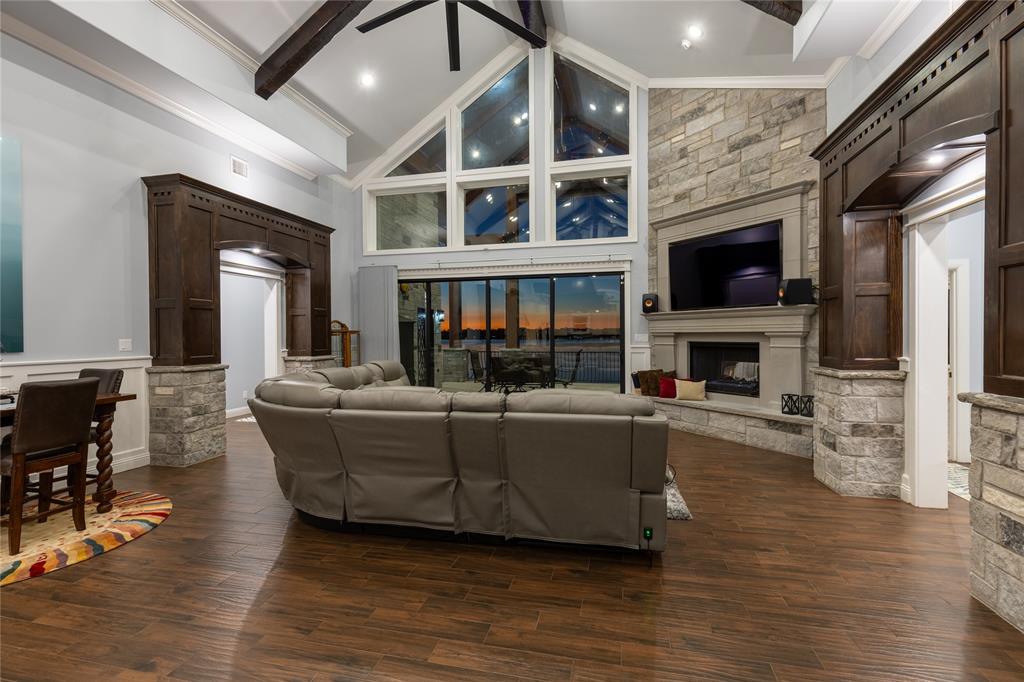 14392 Ridge Lane Malakoff, TX 75148 - Photo 36 of 39 a living room with furniture a fireplace and a flat screen tv
