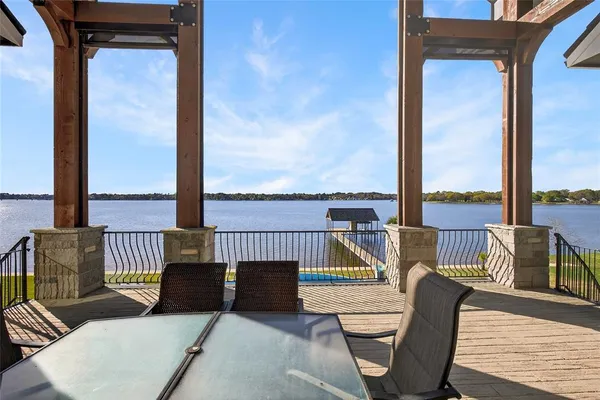 a view of a house with swimming pool and a yard
