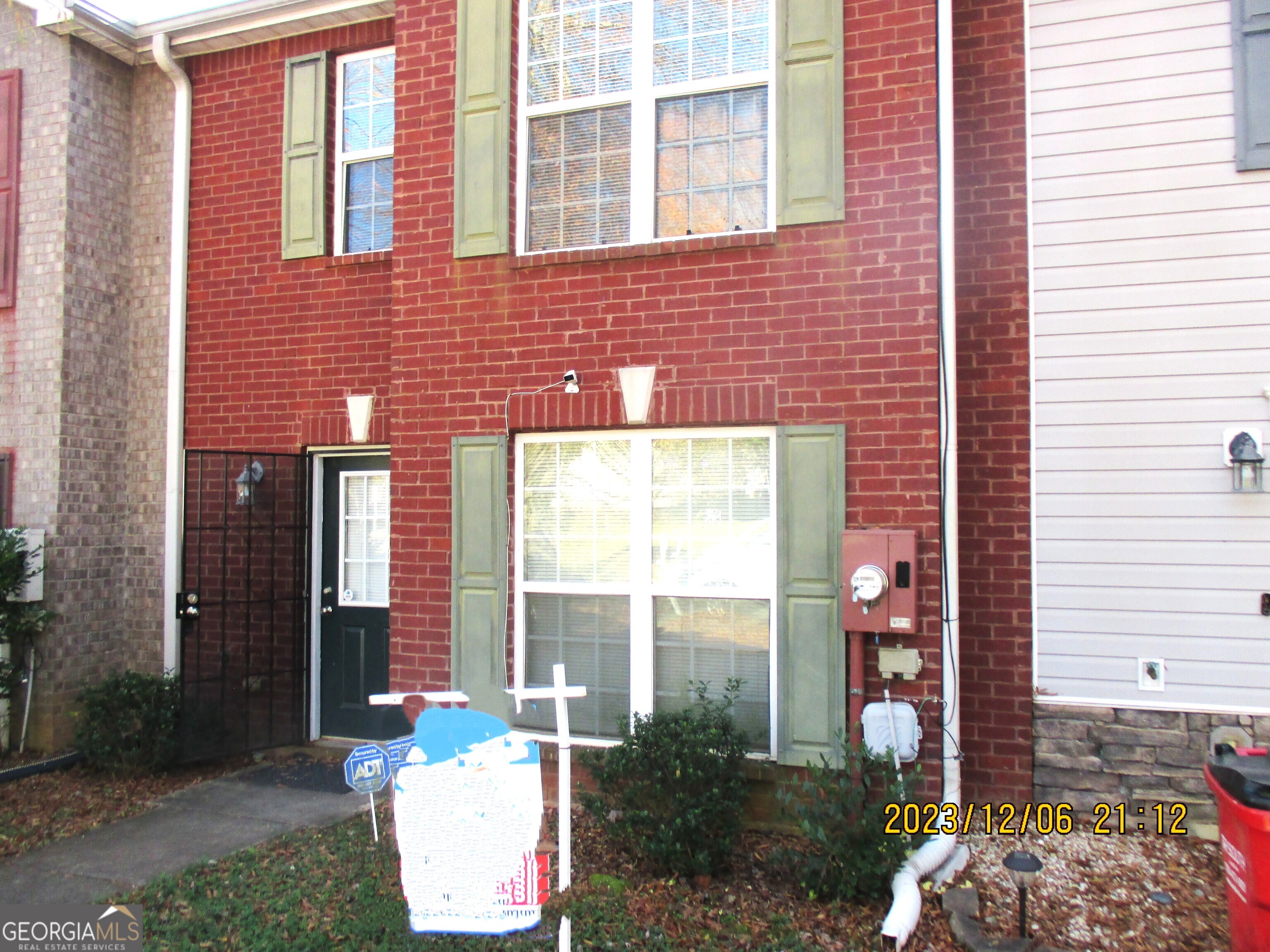 a view of entryway front of house with a yard