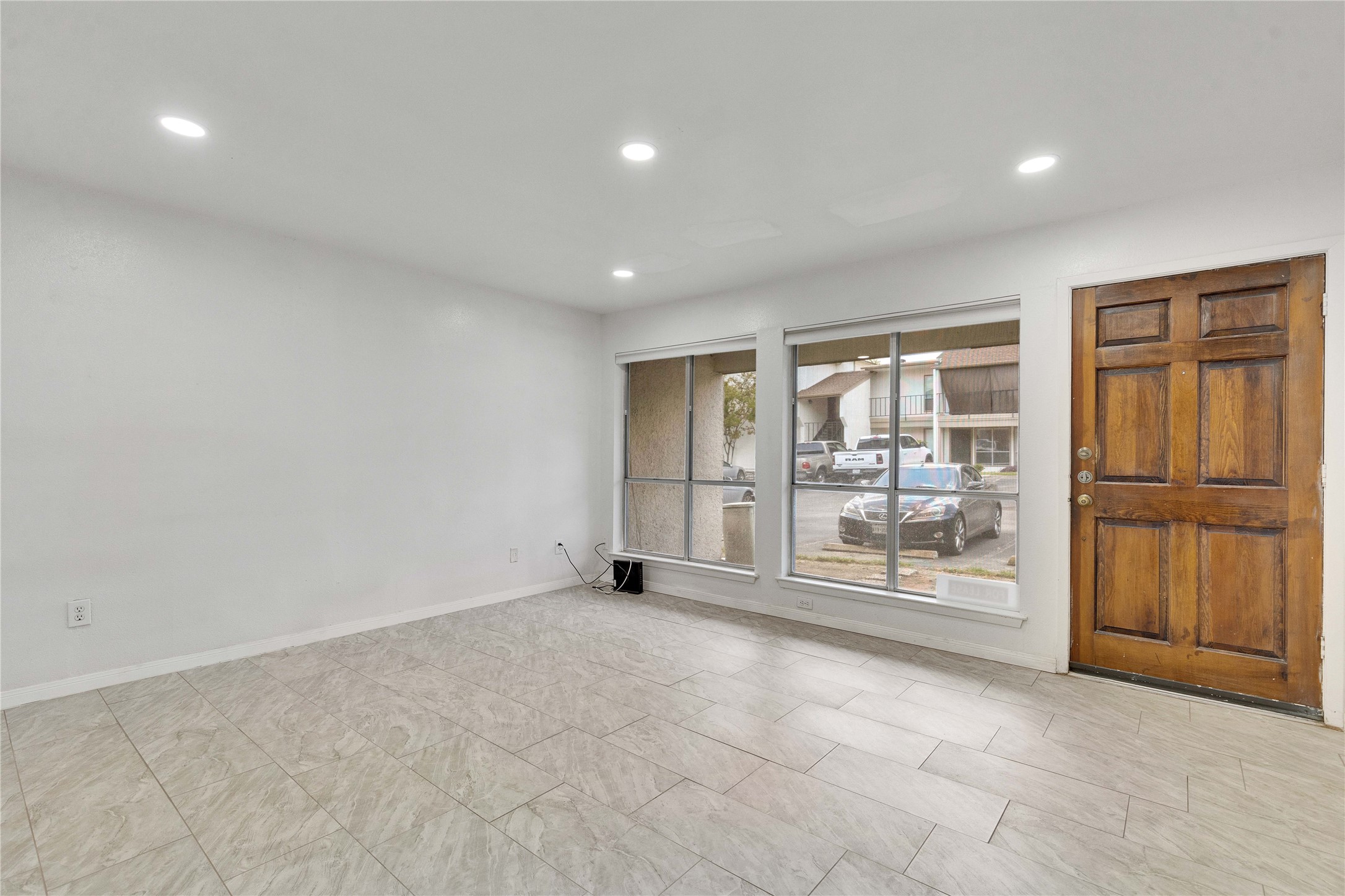 6910 Hart Lane, Unit 403 Austin, TX 78731 - Photo 17 of 20 a view of an empty room with glass door