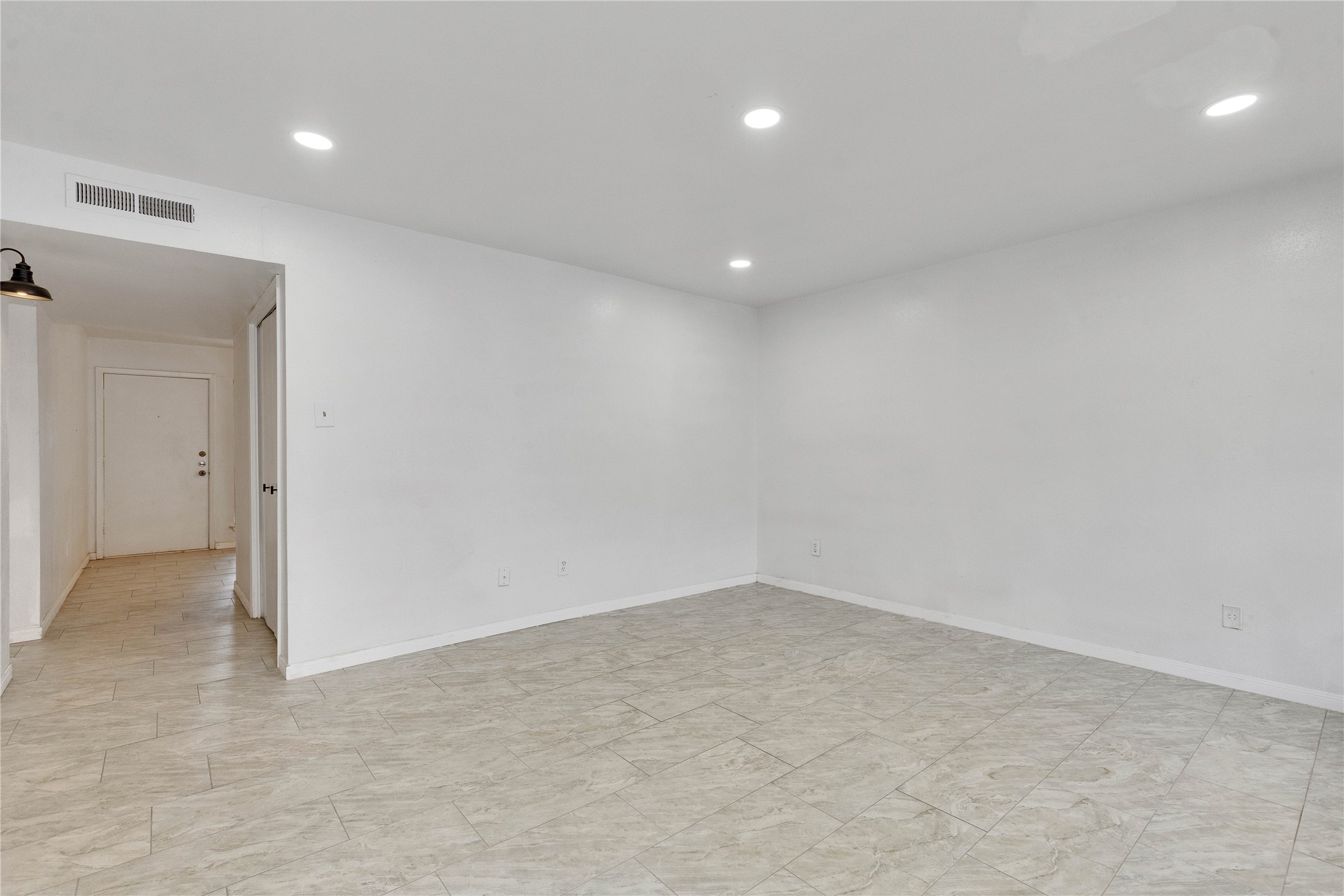 6910 Hart Lane, Unit 403 Austin, TX 78731 - Photo 2 of 20 an empty room with a natural light
