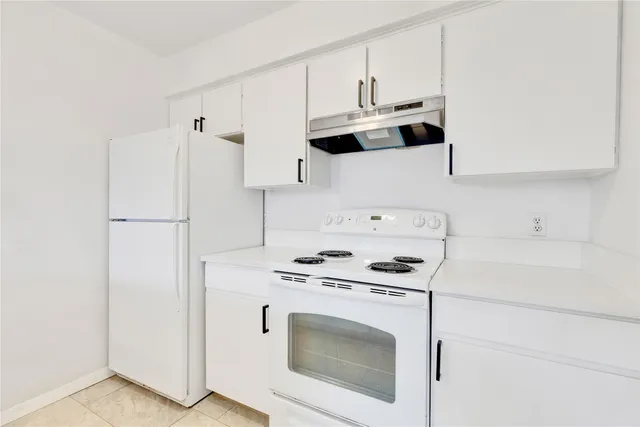 a kitchen with a sink and a window