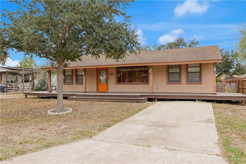 1815 Thornton Street Mission, TX 78572 - Photo 1 of 27 Ranch-style home featuring roof with shingles, stucco siding, and a deck