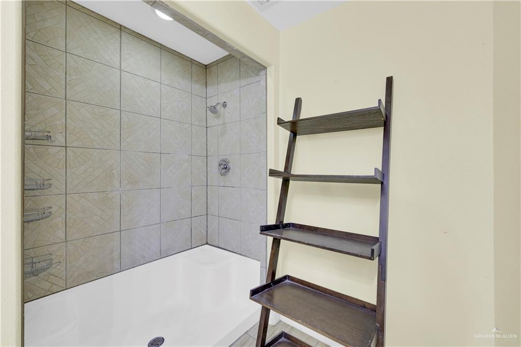 1815 Thornton Street Mission, TX 78572 - Photo 13 of 27 Full bathroom featuring a tile shower