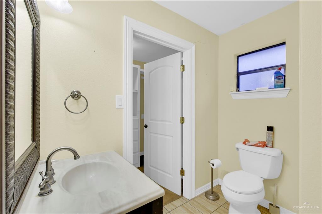 1815 Thornton Street Mission, TX 78572 - Photo 15 of 27 Bathroom with vanity and toilet