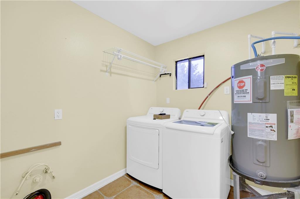 1815 Thornton Street Mission, TX 78572 - Photo 19 of 27 Half bathroom featuring tile patterned floors and two sinks