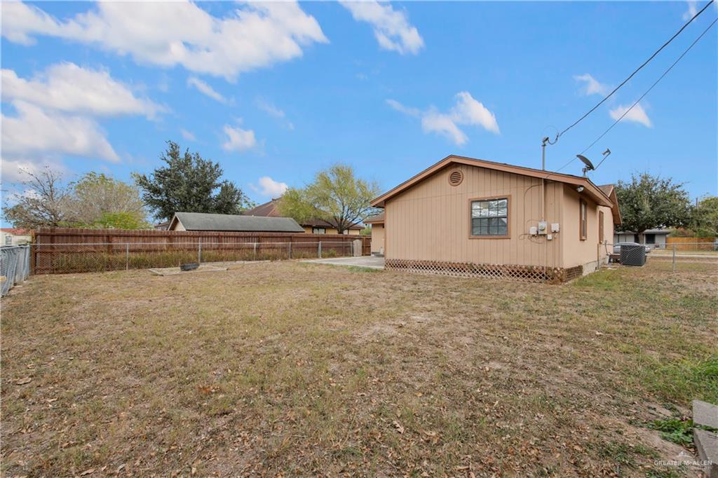 1815 Thornton Street Mission, TX 78572 - Photo 21 of 27 Fenced backyard featuring a patio