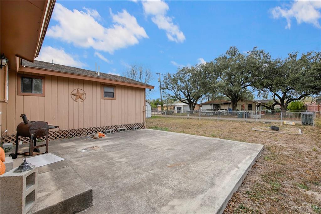 1815 Thornton Street Mission, TX 78572 - Photo 22 of 27 Fenced backyard with a patio