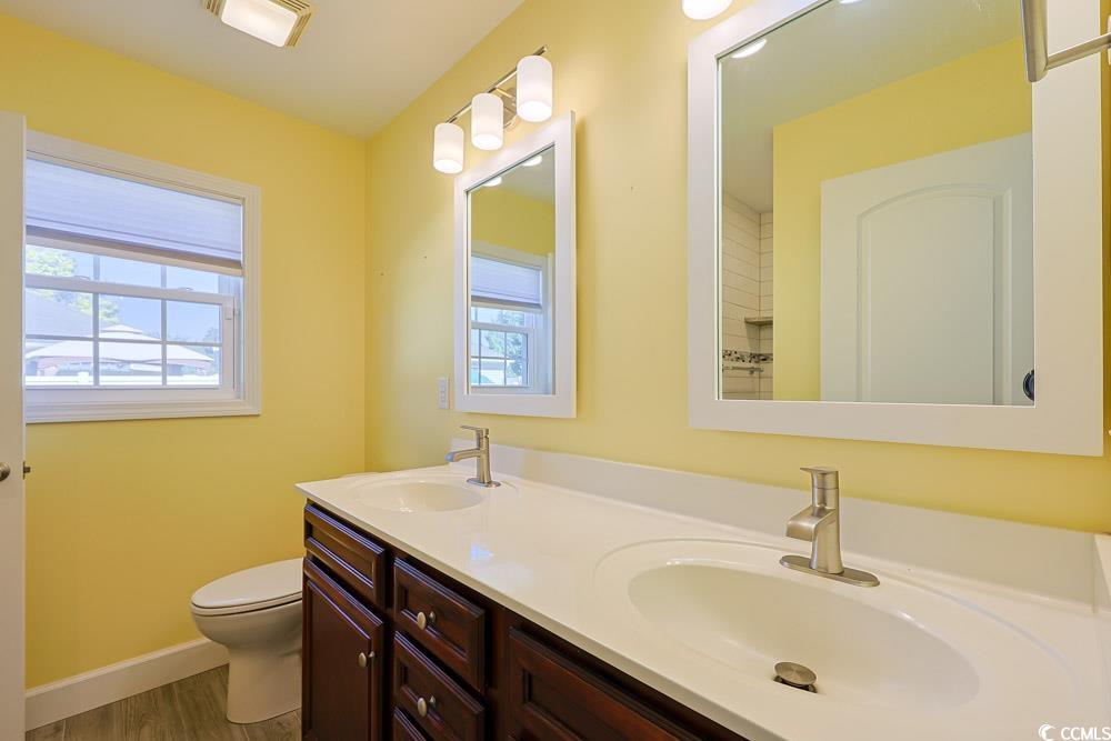 1036 Macala Drive Conway, SC 29527 - Photo 15 of 34 Bathroom with double vanity and dark wood finished floors