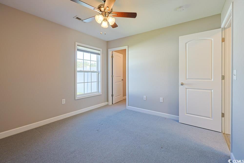 1036 Macala Drive Conway, SC 29527 - Photo 18 of 34 Unfurnished bedroom featuring light colored carpet and a ceiling fan