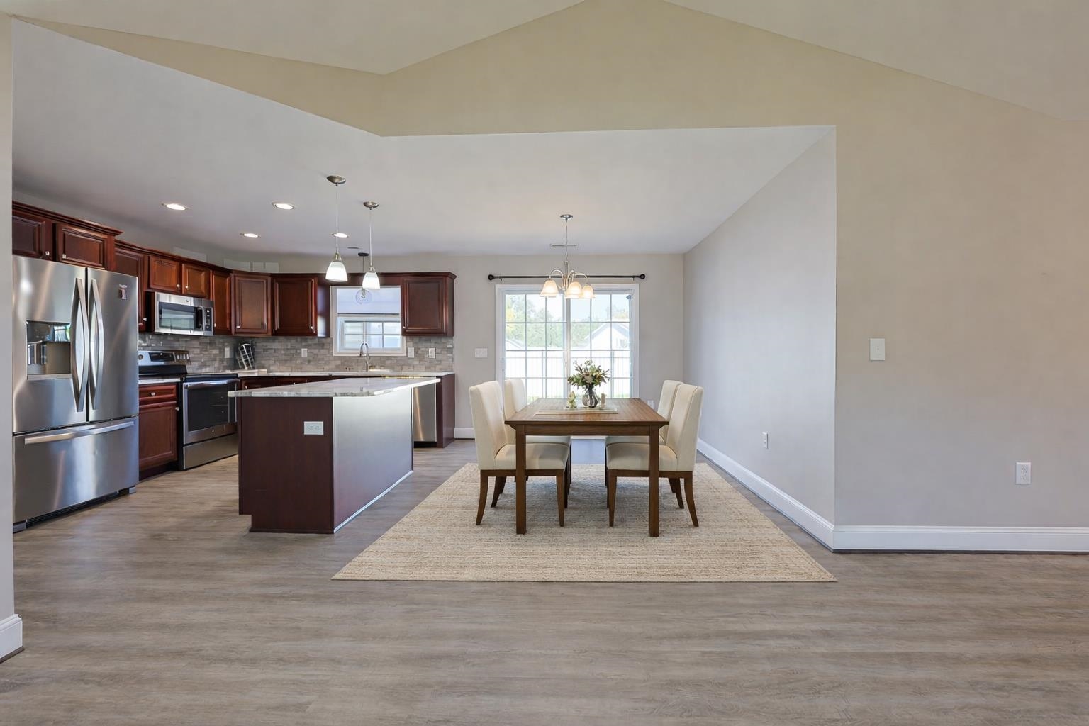 1036 Macala Drive Conway, SC 29527 - Photo 8 of 34 Kitchen with stainless steel appliances, pendant lighting, a kitchen island, a chandelier, and dark wood-type flooring