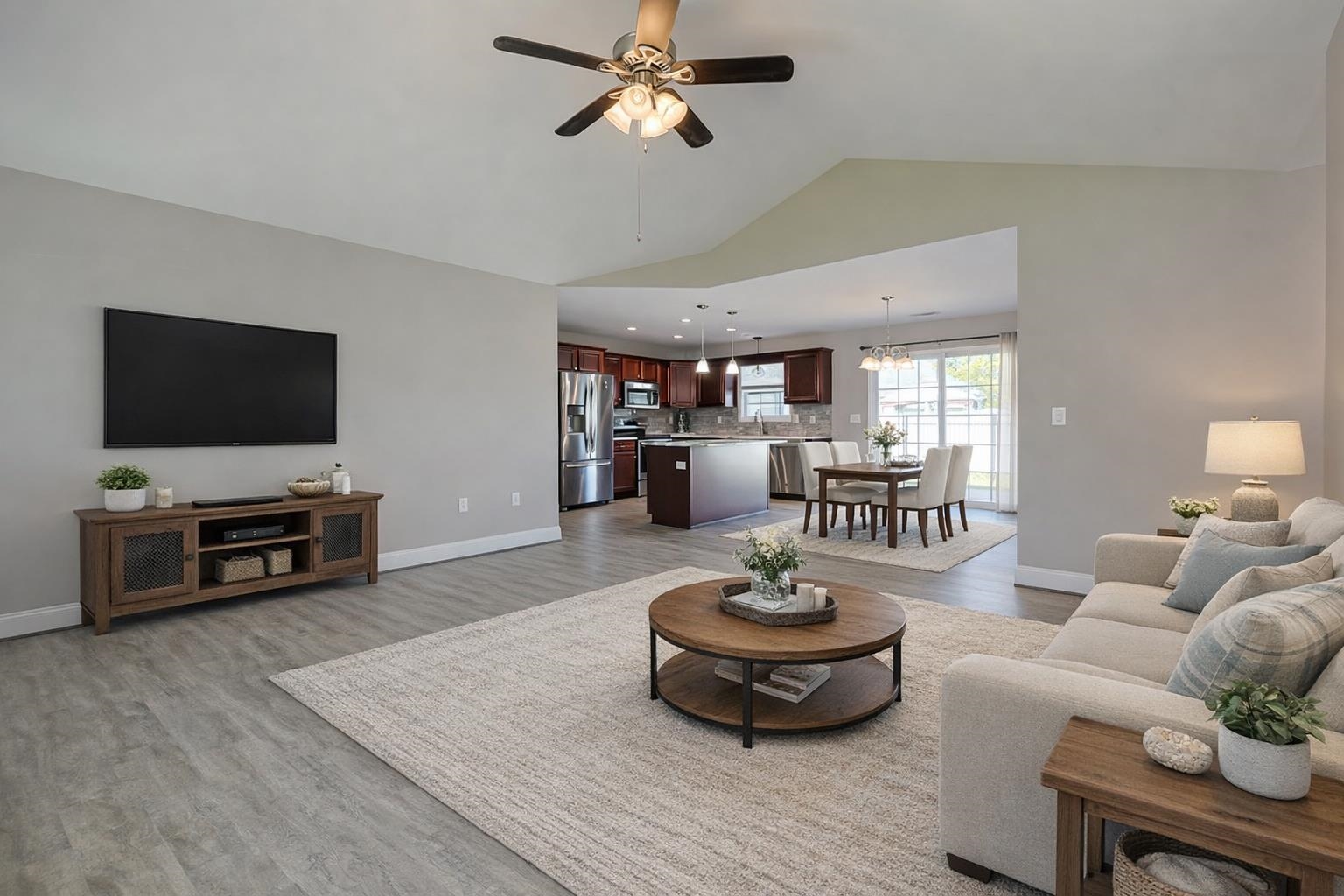 1036 Macala Drive Conway, SC 29527 - Photo 9 of 34 Living room featuring lofted ceiling, light wood-type flooring, ceiling fan, and a chandelier