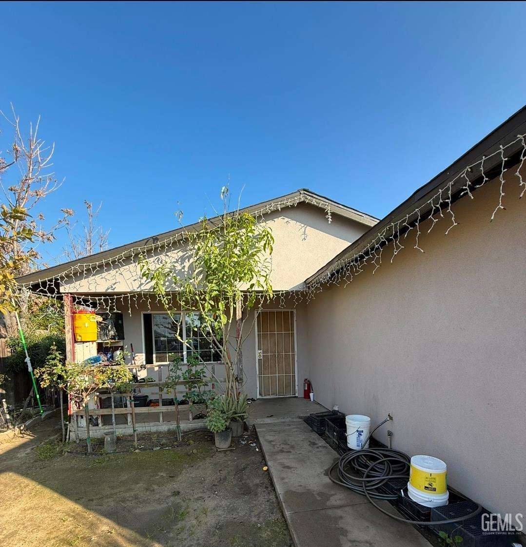 Undisclosed Address Wasco, CA 93280 - Photo 2 of 7 a view of a patio with table and chairs and potted plants