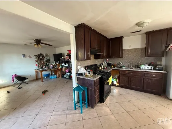 a kitchen with a cabinets and appliances