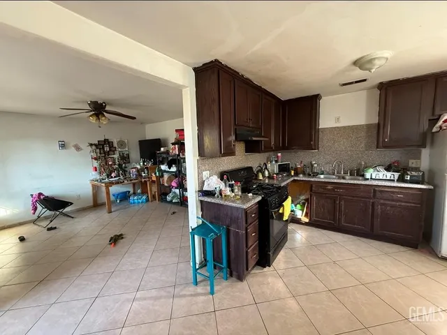 a kitchen with a cabinets and appliances