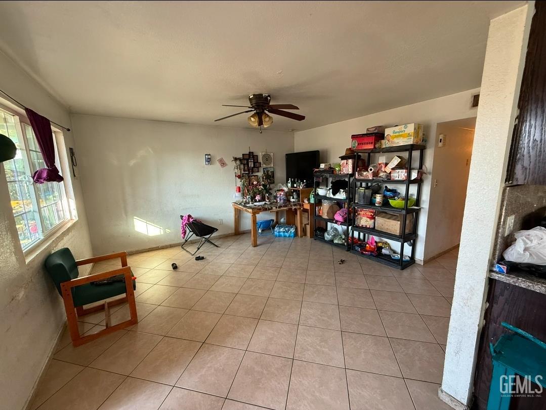 Undisclosed Address Wasco, CA 93280 - Photo 5 of 7 a room with furniture and a flat screen tv