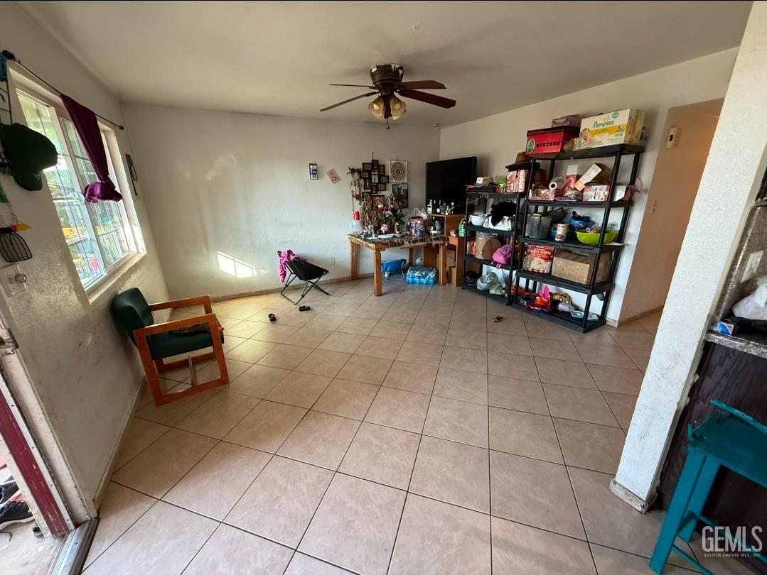 Undisclosed Address Wasco, CA 93280 - Photo 6 of 7 a living room with lots of furniture and a flat screen tv
