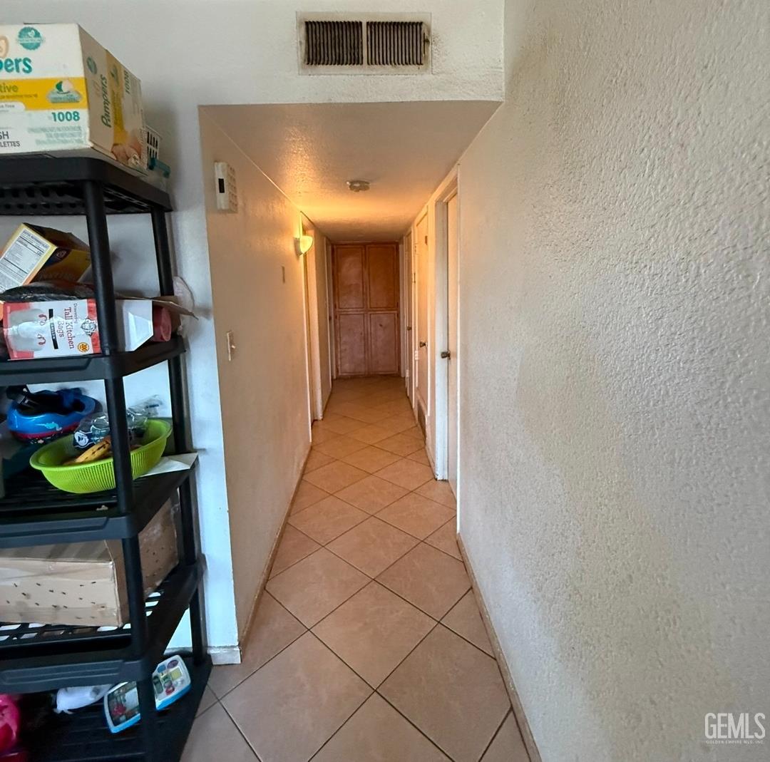Undisclosed Address Wasco, CA 93280 - Photo 7 of 7 a view of hallway with furniture and toys