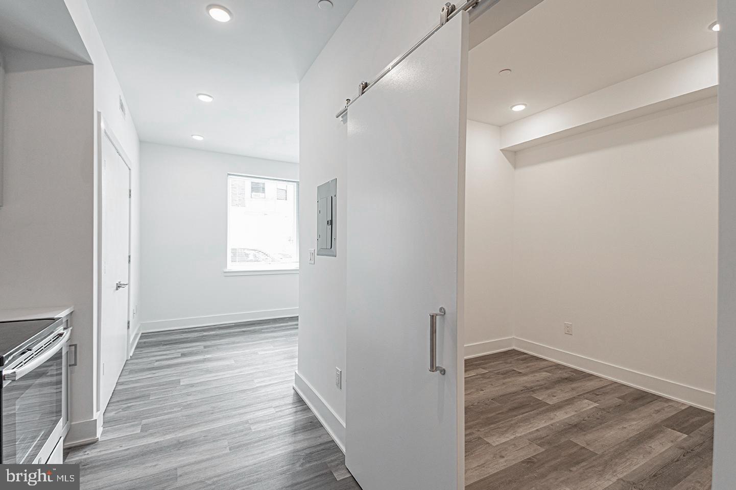 1245 Ridge Avenue, Unit 103 Philadelphia, PA 19123 - Photo 7 of 18 a view of a hallway with wooden floor