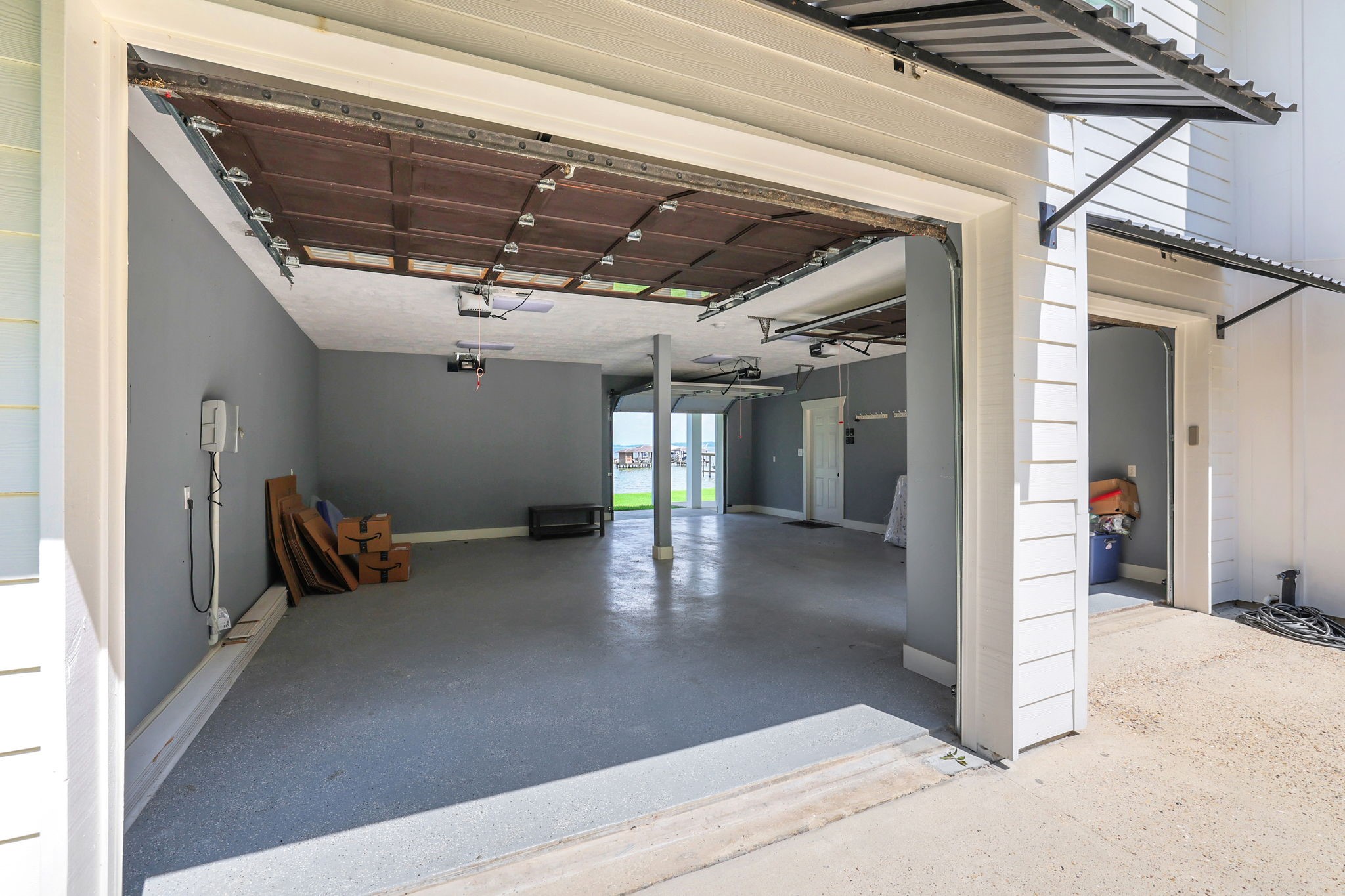 231 Ridge Cove Lane Coldspring, TX 77331 - Photo 39 of 50 The garage has overhead doors on both sides - open them up and let that lake breeze through!