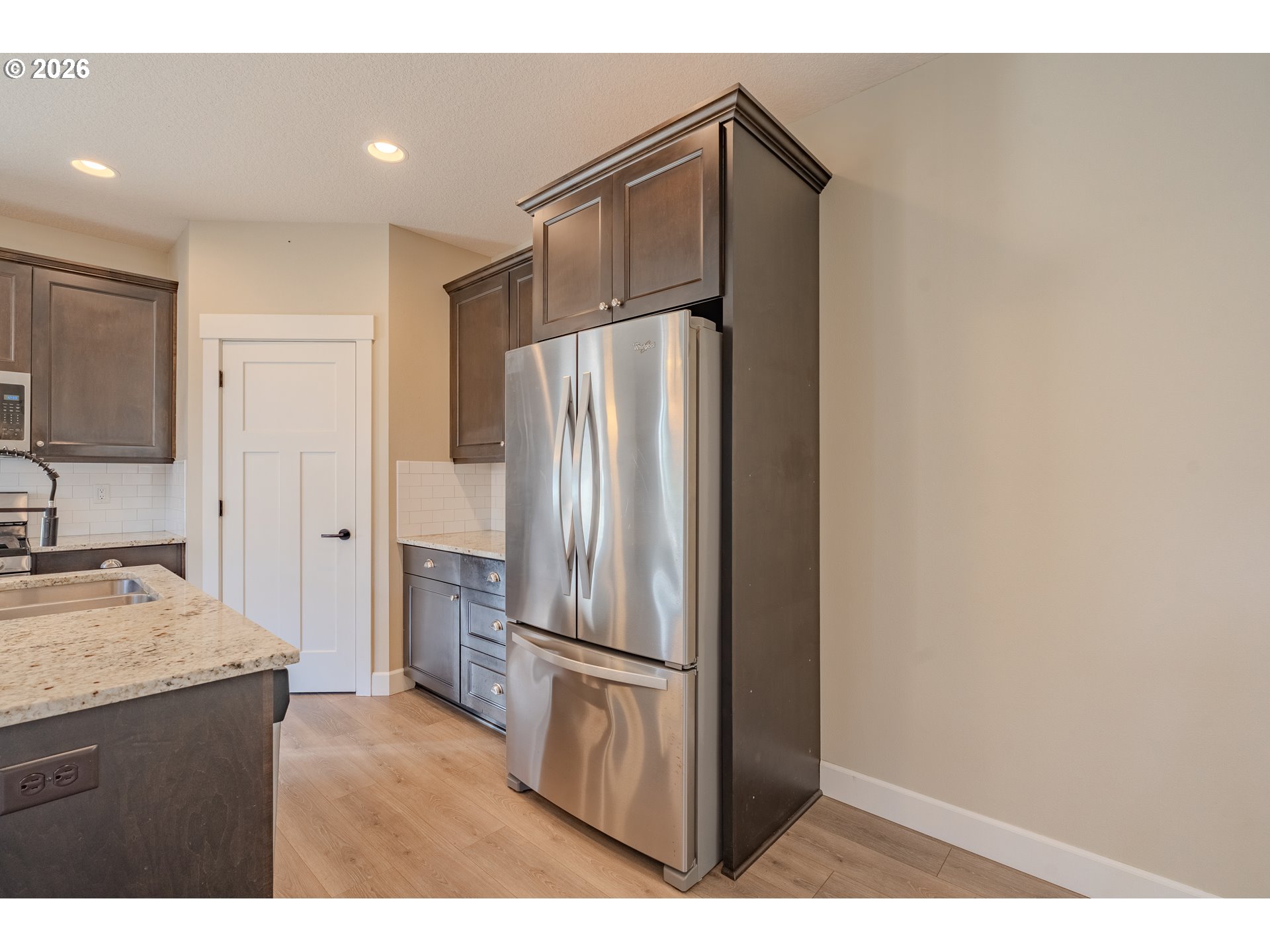 1145 South Quail Run Place Ridgefield, WA 98642 - Photo 18 of 41 a kitchen with stainless steel appliances a refrigerator and a sink