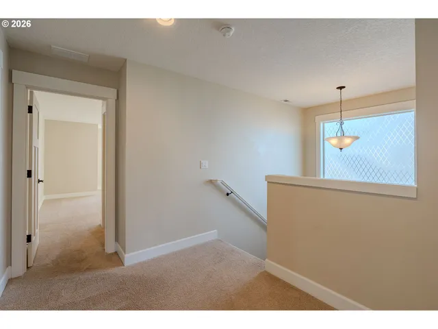 a view of a hallway with a white walls