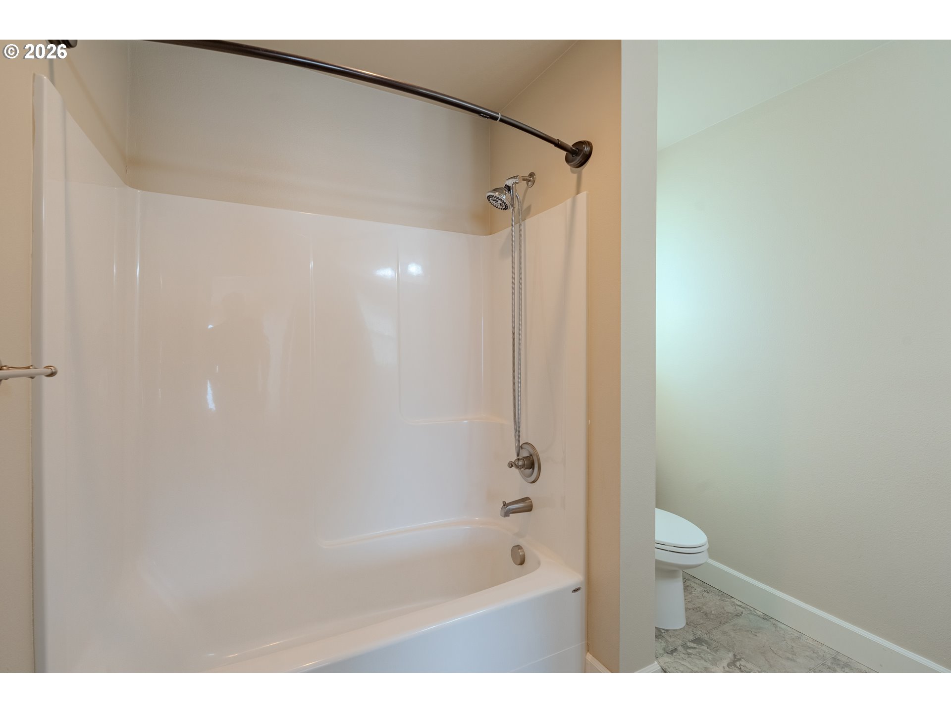 1145 South Quail Run Place Ridgefield, WA 98642 - Photo 28 of 41 a bathroom with a bathtub and a shower