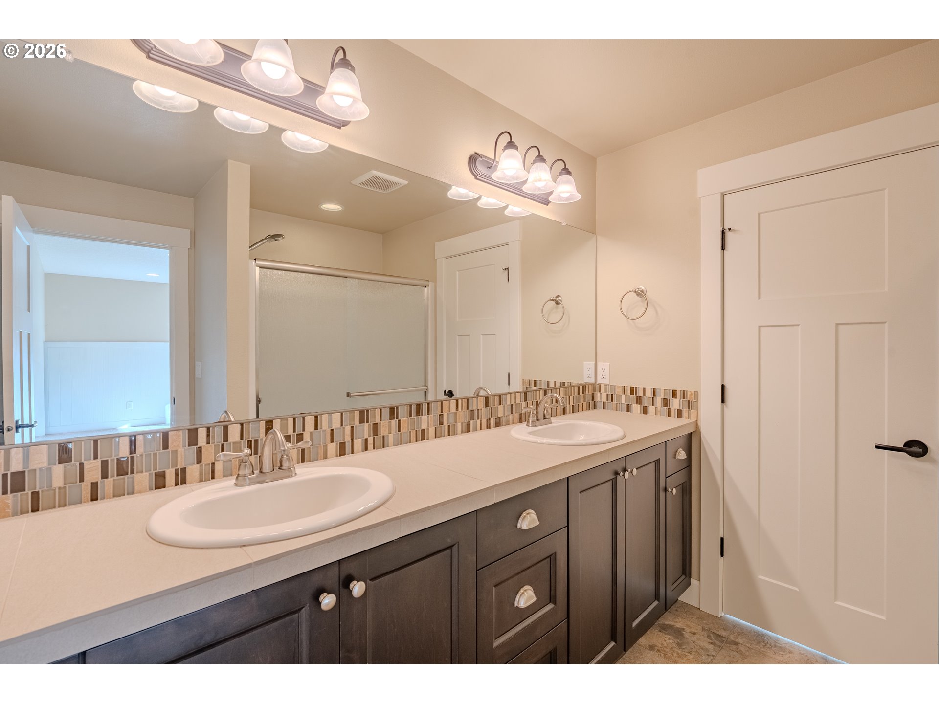 1145 South Quail Run Place Ridgefield, WA 98642 - Photo 35 of 41 a bathroom with a sink double vanity and a mirror