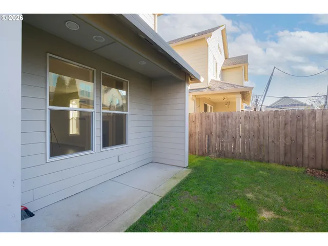 a view of front door of house and yard