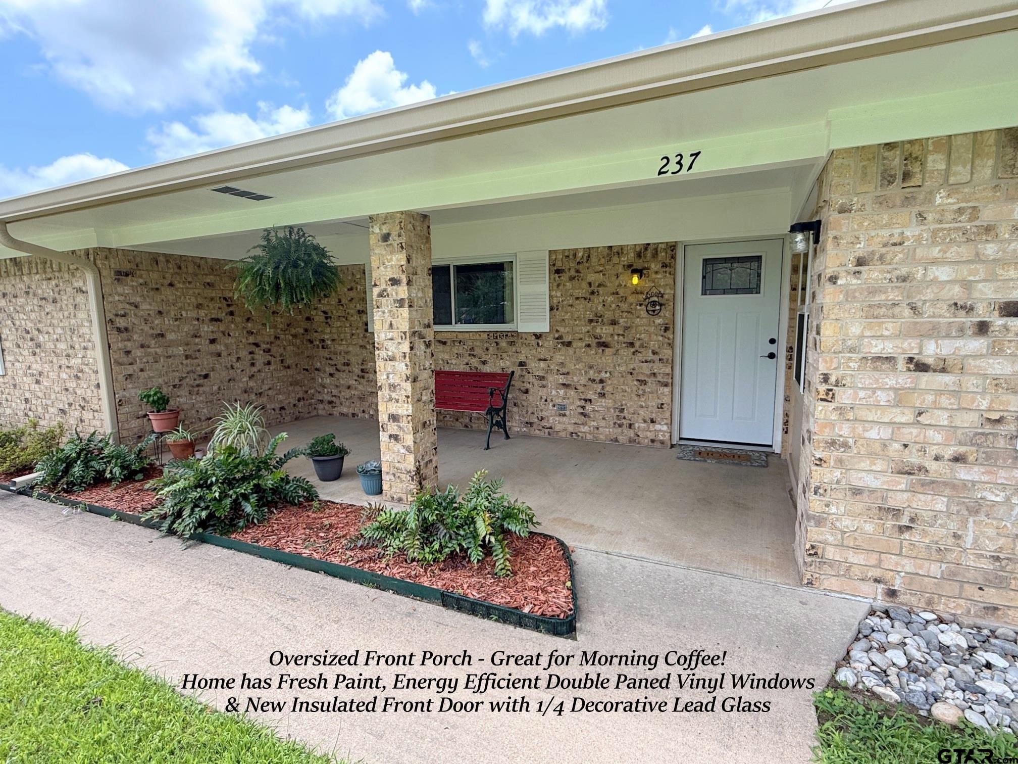 237 Oregon Street Van, TX 75790 - Photo 3 of 44 a front view of a house with a garden