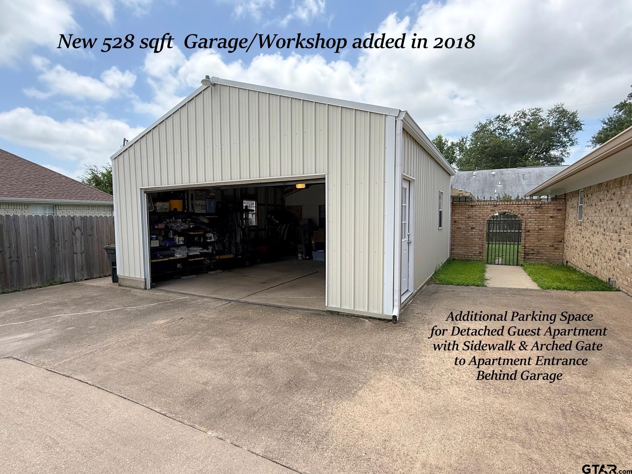 237 Oregon Street Van, TX 75790 - Photo 31 of 44 a view of a house with a yard and garage