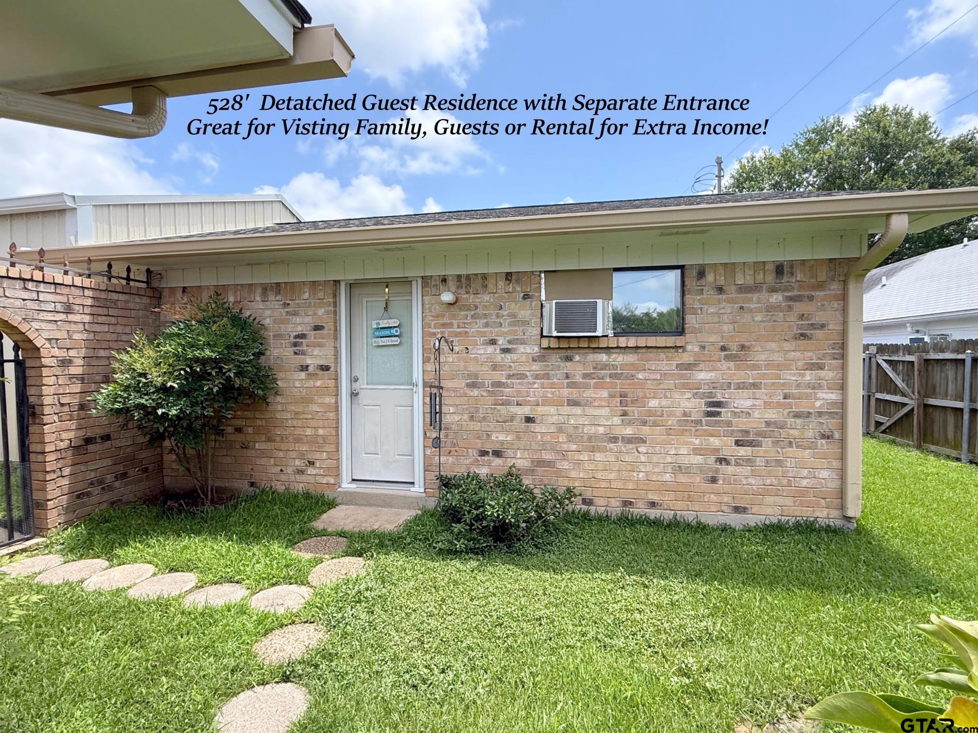 237 Oregon Street Van, TX 75790 - Photo 33 of 44 a front view of a house with a garden