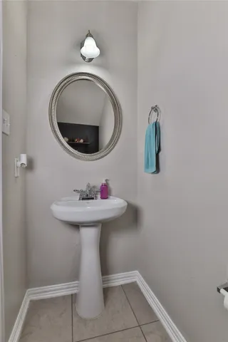 a bathroom with a sink and mirror