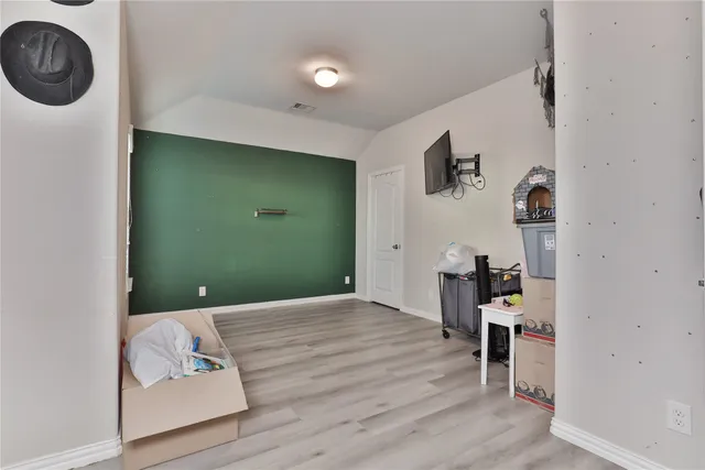 a view of a livingroom with furniture and wooden floor