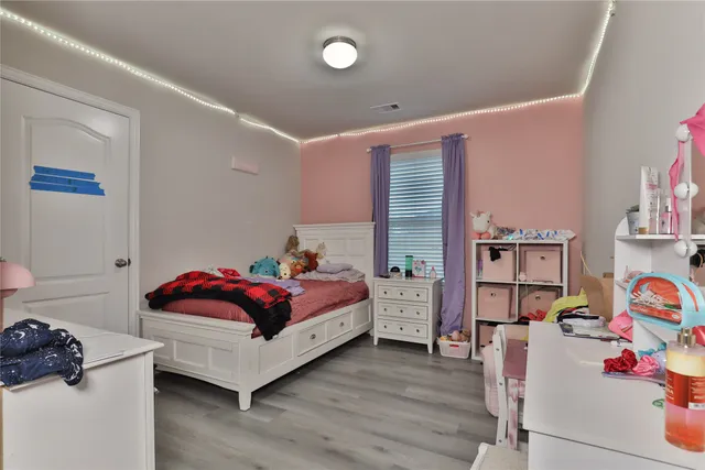 a bedroom with furniture and a bed