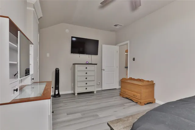 a living room with furniture a fireplace and a table
