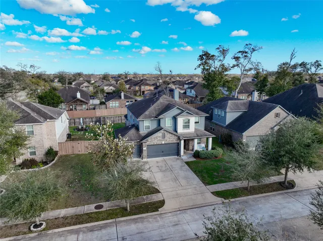 an aerial view of a house with a garden